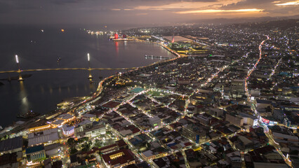Obraz premium aerial view of Cebu City illuminated at night , evening in this major Philippine metropolis skyline cityscape 