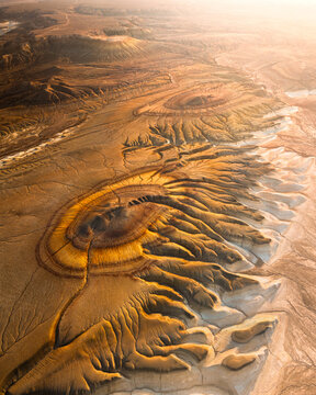 Aerial view of the earth's raw textures and warm tones meet in a breathtaking landscape, sculpted by time and nature's artistry, Aktau, Mangystau Region, Kazakhstan.