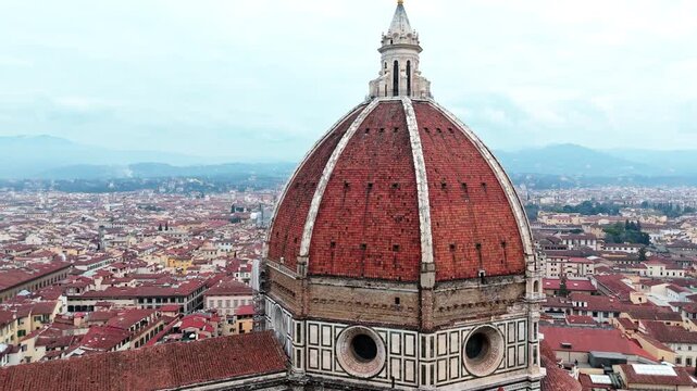 Aerial view of Florence's iconic cathedral dome on a cloudy day