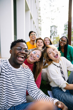 A Joyful Group of Friends Gathering Together, Excitedly Enjoying a Beautiful Day Outdoors