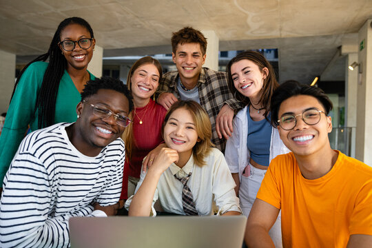 A Diverse Group of Young Professionals Engaging in Collaborative Activities in a Modern Workspace