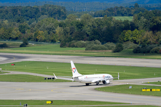 Mavi G&ouml;k Airlines MGA passenger airplane type Boeing 737-800 registration TC-MGO leaving Swiss Z&uuml;rich Airport on a late summer day. Photo taken September 2025, Zurich Airport, Switzerland.