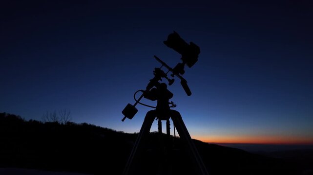 Amateur astrophotography equipment with camera, tripod star-tracker for photographing stars, planets and Moon.