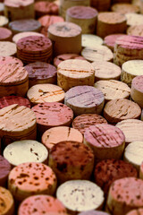 Fototapeta premium Natural corks texture as rustic background for interior design projects. Red beige color wine cork textured pattern surface from organic material qualities, craft aesthetics and eco oriented visual