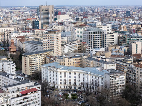 Aerial view of buildings with contrasting architectural styles, where modern glass towers meet classical facades, Bucharest, Bucharest, Romania.