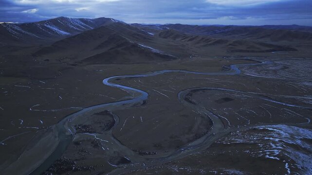 Aerial panoramic view of Manzetang Wetland Nature Reserve at twilight: The winding Jiaqu River under the blue hour on the Zoige Plateau