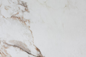 Fototapeta premium Light colored marble surface with subtle brown veins and unique natural patterns and textures