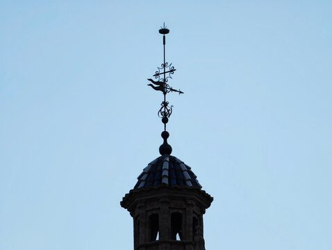 Silhouette Over Subdued Sky, Architectural Structure Featuring Crowning Iron Ornament And Simple Design
