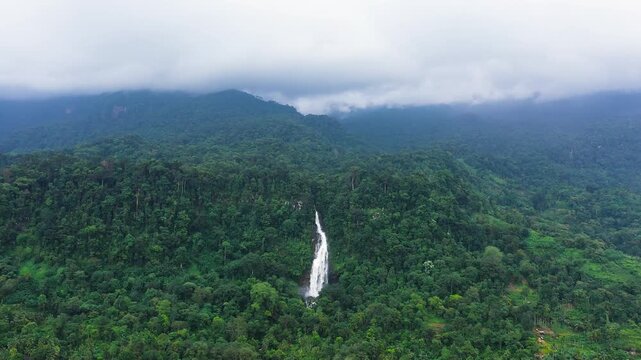 Aerial drone of tropical waterfall in the jungles. Mapalana Falls. Sri Lanka.