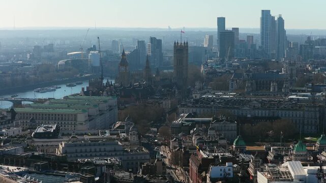 Elevated view from a unique tripo perspective of Big Ben and Palace of Westminster in London with Vauxhall district buildings towering in distant background