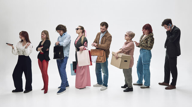 Group of diverse people standing in queue isolated on white background waiting in line. Concept of waiting time, customer service delay, urban routine, and social behavior patterns.