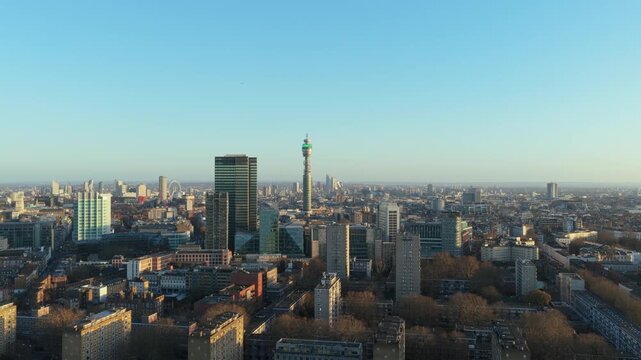 Aerial cityscape from a tripod unique perspective of London's Fitzrovia district with iconic BT Tower and urban architecture under a clear sky in England's capital