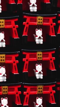 Traditional Japanese tourist souvenirs and gifts from Kyoto, Kansai, Japan, with daruma figures, kitsune fox, tengu mask, fridge magnets, toys figurines, key ring keychain, in a local vendor gift shop