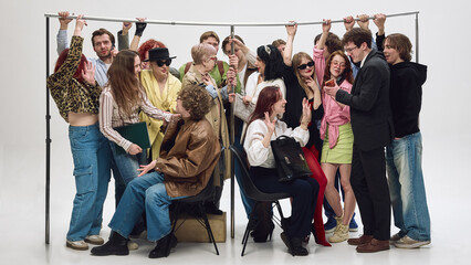 Diverse group of people standing very close holding rail in tight subway setup. Concept of crowd...