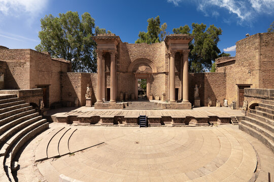 View of ancient Roman theatre ruins stand proudly under a clear blue sky, a testament to history and architectural prowess, Annaba, Algeria.