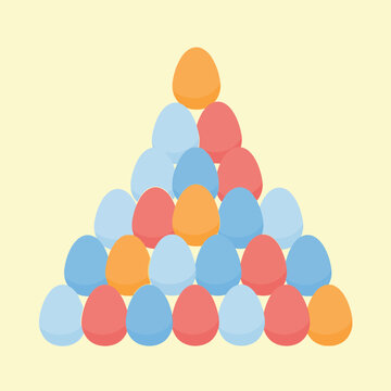 Colorful eggs stacked in pyramid.