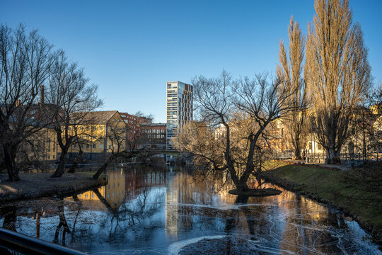 Motala Stream and the industrial landscape at Gamlebro during a spring sunset. Norrk&ouml;ping is a historic industrial town in Sweden.