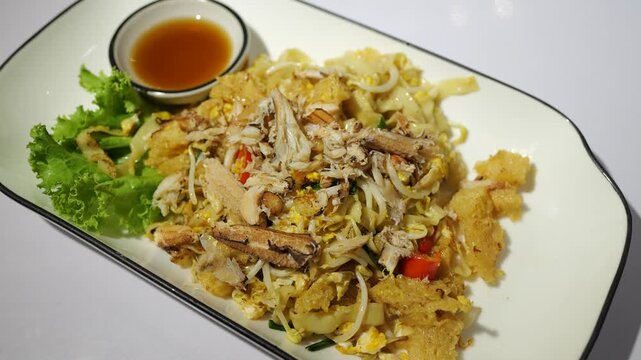 Stir Fried Fish Maw with Crab Meat The menu is both street food and restaurant food in Thailand. It is very popular for both Thai people and tourists