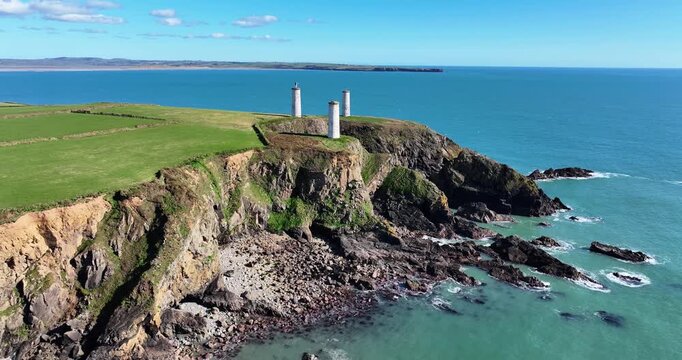 Tramore Bay Waterford Ireland three pillars and metal man in middle pillar warning danger to ships epic locations