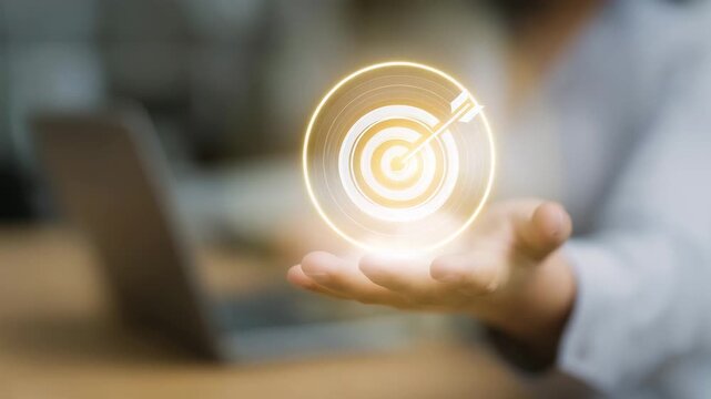 Hand holding target icon, business goal concept, success strategy, objective achievement, marketing planning, focus, digital business, leadership