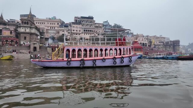 Passenger Boat on Ganga River with Varanasi Ghats Background India