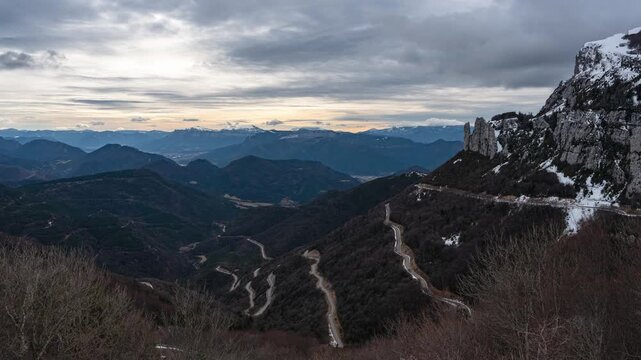 Col du Rousset mountain road timelapse, winding alpine road with moving clouds in Vercors massif, France