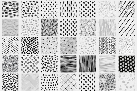 A grid of thirty six diverse black and white abstract patterned squares