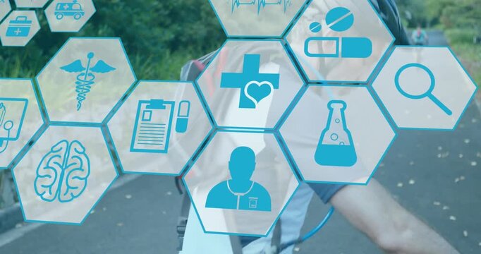 Animation of medical icons over caucasian couple cycling