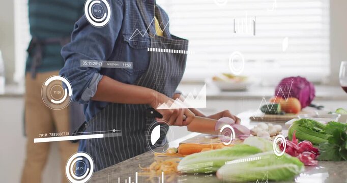 Woman slicing onion, carrot and greens in kitchen for meal prep while HUD updating chopping metrics