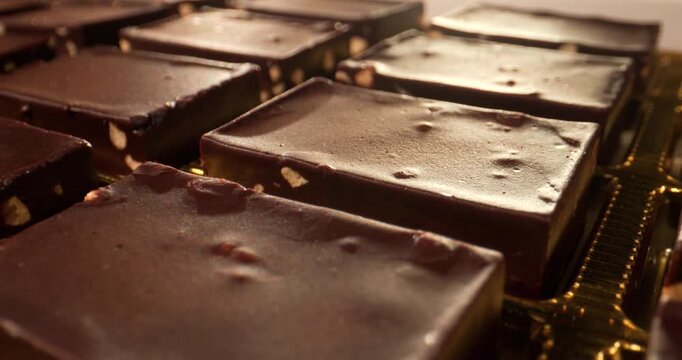 Chocolate desserts made with nuts and fudge shown from a close view at a dessert shop during daytime