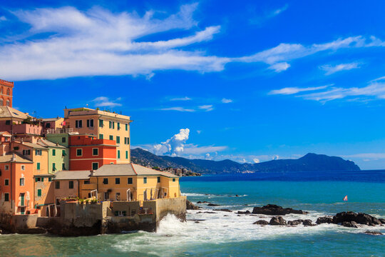 Picturesque view of beach, blue sea and colorful buildings of Boccadasse, old fishing village, in Genoa, Italy