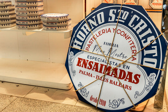 Horno Santo Cristo bakery display featuring traditional ensaimadas pastry boxes in Palma de Mallorca in Spain.