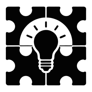 Vector of a light bulb symbol surrounded by interlocking puzzle pieces