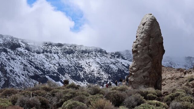 Snow covered Teide volcano landscape after storm Therese in Tenerife Canary Islands, dramatic clouds, volcanic terrain and winter conditions in subtropical island
