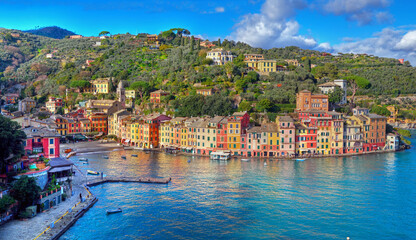 Fototapeta premium the famous little square of the Ligurian seaside village with its restaurants and shops Portofino Italy 