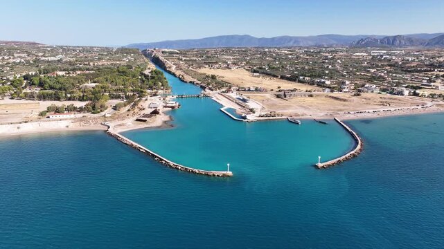 Aerial drone rotational video of Corinth Canal entrance of Isthmos or Isthmus, Peloponnese, Greece