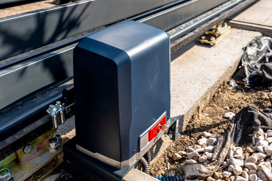 Automatic sliding gate motor drive installation