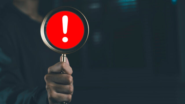 Warning alert and risk management with magnifying glass and exclamation mark icon. Danger detection, problem identification, cybersecurity threat, error notification and business risk analysis.