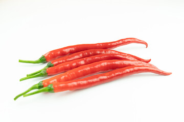 Naklejka premium Fresh red peppers on a white background