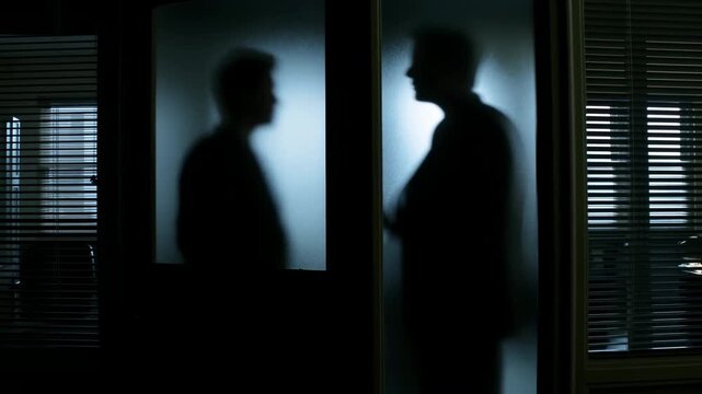 Dim Blue Lighting Amplifies Covert Confrontation Between Business Leaders Behind Glass Walls