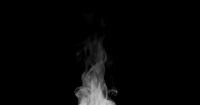 White isolated steam rises in graceful curves on a black background in slow motion. This steam trickle is perfect for overlay use with various blending modes, hot drink or food steam concepts.