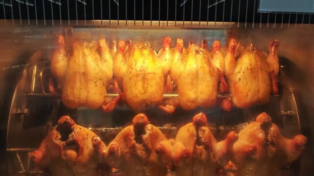 Grilling whole chickens in rotisserie machine
