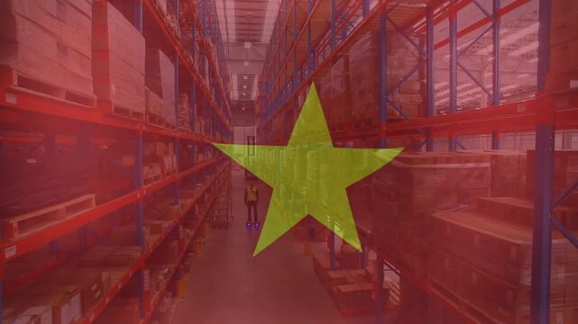 Animation of flag of vietnam over caucasian male worker in warehouse