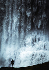 man and waterfall