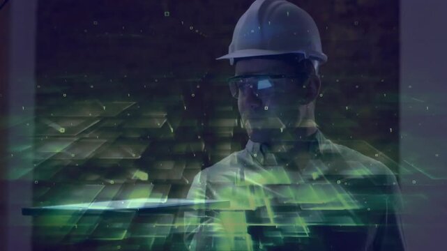 Male engineer in hard hat raising arm swiping hologram revealing green data streams for analysis