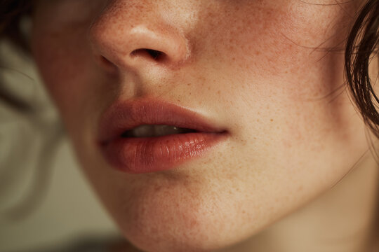 Close up portrait of woman with detailed skin texture freckles and facial hair realistic skincare concept
