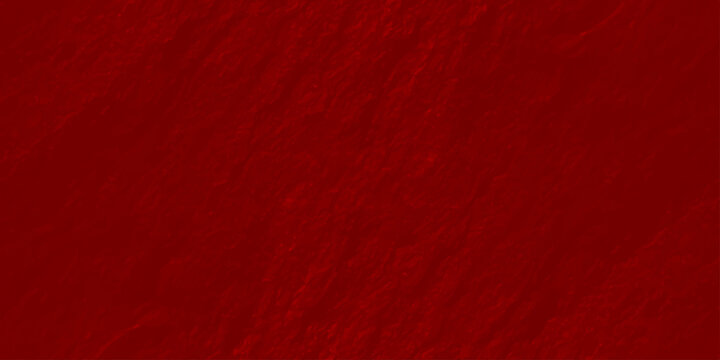 Deep red textured wall background with organic rough plaster surface and soft shadows
