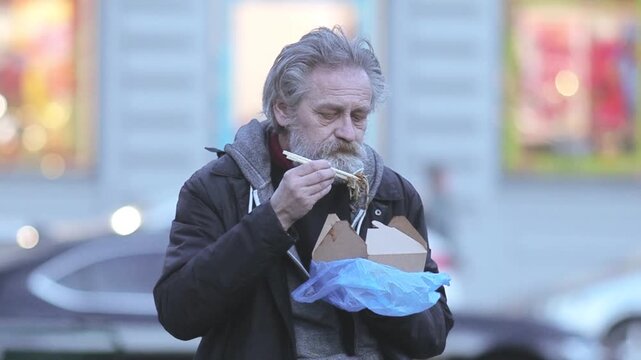 City Life Rhythms - Senior Man Smoking and Phoning on Busy Street
