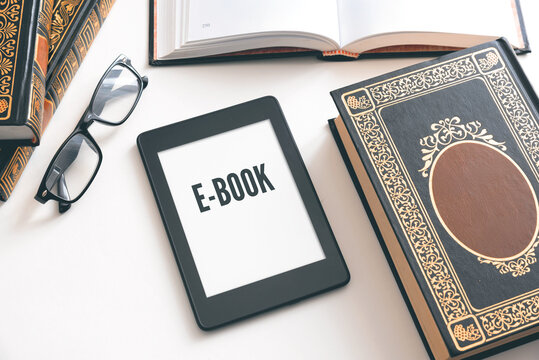 E-book reader device on desk in library