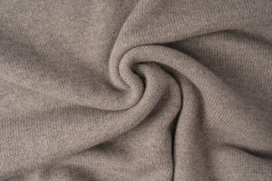 Soft grey merino wool sweater texture as a background.